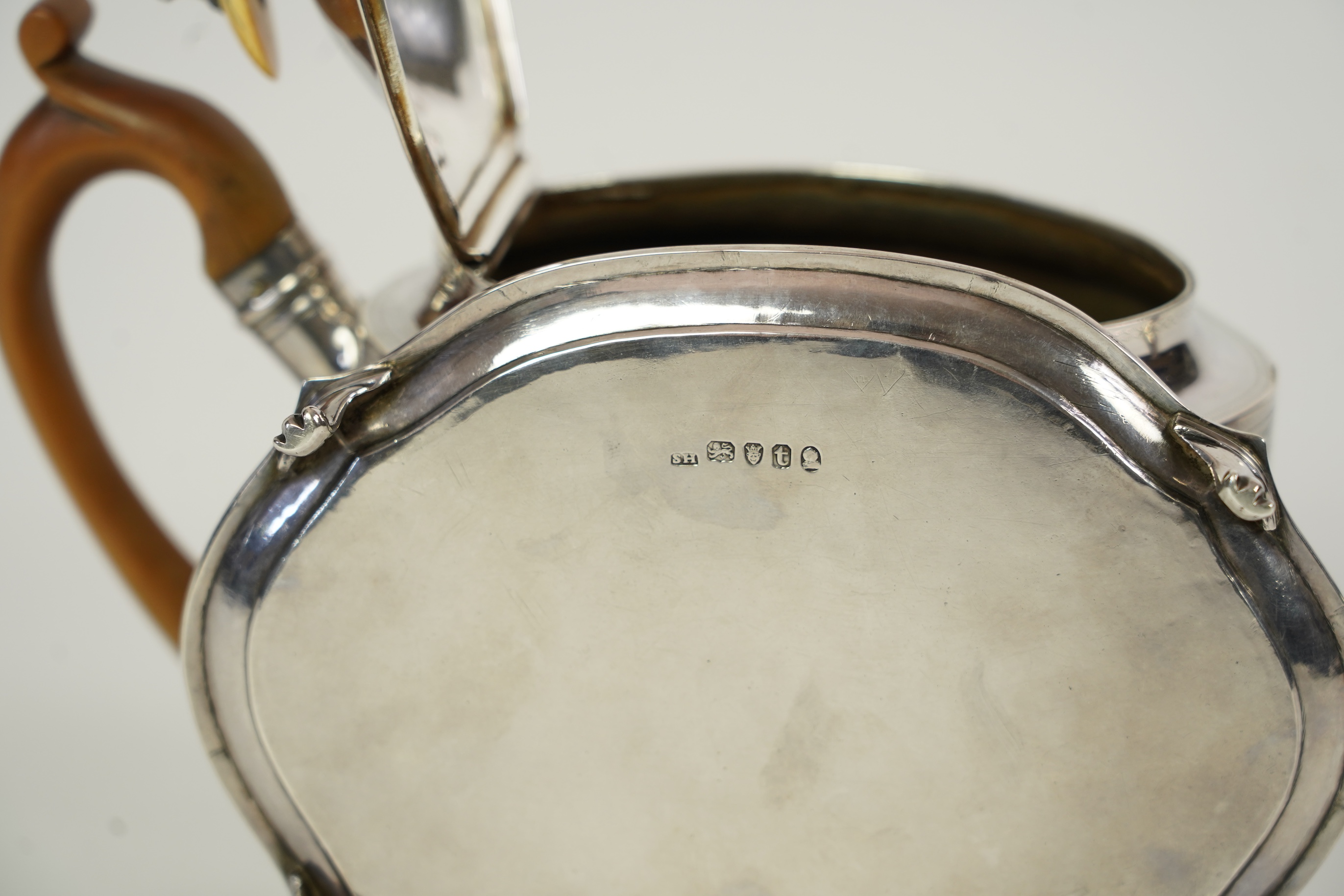 A George III silver teapot and matching stand, by Soloman Hougham